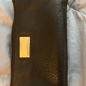 Juicy Couture wristlet. Lightly used. No signs of wear. Super roomy.